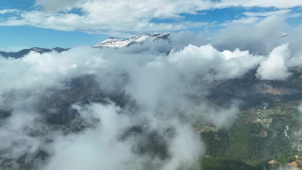 Cloudy landscape high in the mountains aerial view 4 K alt