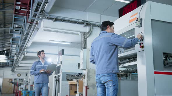 specialist worker engineer team control and operate printing package lable machine alt