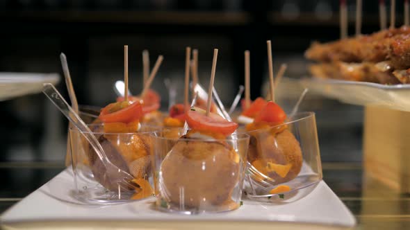 Showcase Window Display Assortiment with Tapas – Traditional Spanish Sandwiches Starters in a Cafe alt