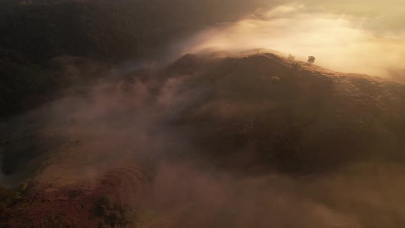 4K Aerial view of Mountains landscape with morning fog. alt