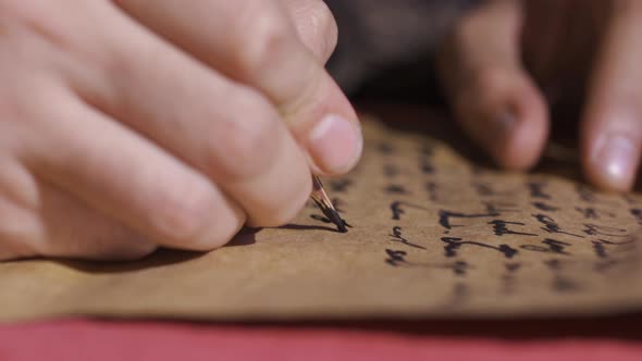 Words written with pen on paper in historical setting. alt