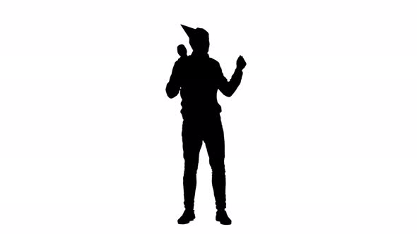 Man in Cap Dances at a Party . White Background. Silhouette alt