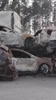 Vertical Video of a Dump of Destroyed Cars During the War in Ukraine alt
