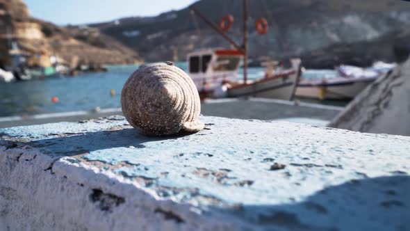B-roll of a sea shell in a little harbor of Milos island of Greece alt