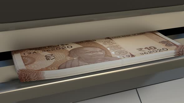 10 Indian rupees  in cash dispenser. Withdrawal of cash from an ATM.
