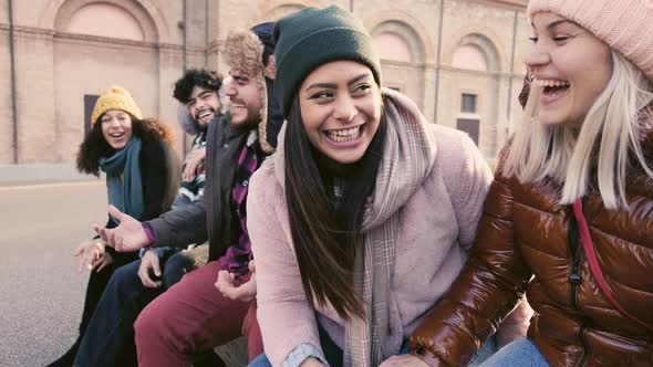 Group of multiethnic friends laughing together outdoor