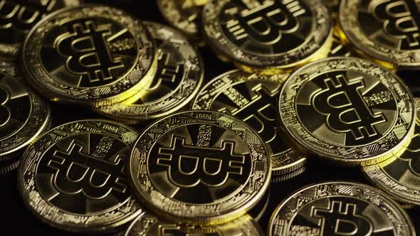 Rotating shot of Bitcoins  alt