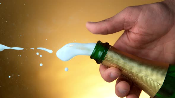 Super Slow Motion Shot of Champagne Explosion on Golden Luxury Background at 1000Fps alt