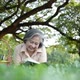 elderly woman, lying and relaxing on the green lawn - VideoHive Item for Sale