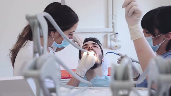 Patient getting dental treatment at dental clinic