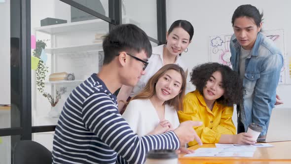 Group of asian young creative happy people entrepreneur on a business meeting office alt