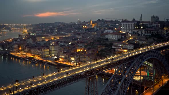 People Walking Across the Dom Luis I Bridge in Porto, Portugal. Panning Evening Shot alt