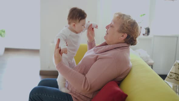Grandmother with Her Cute Granddaughter Baby Smiling Talking Playing alt