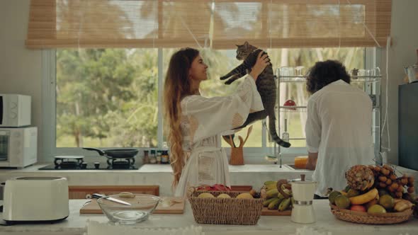 Young Happy Active Married Couple Dancing Laughing Together Cooking Meals at Home Carefree Joyful alt