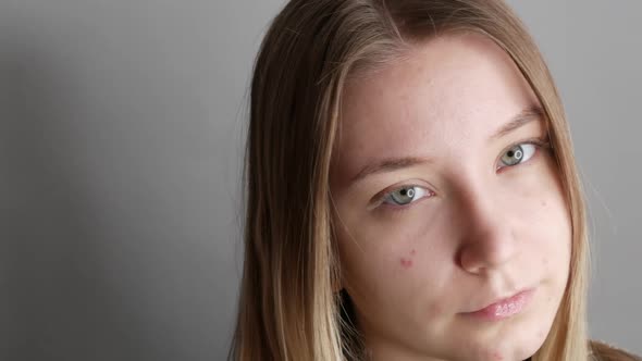 Beautiful Young Girl Without Makeup with a Natural Appearance Posing in Front of the Camera in the alt