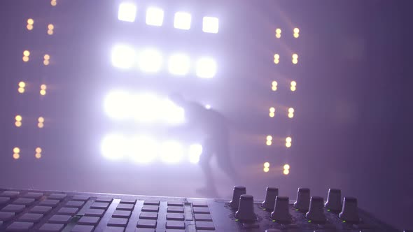 Breakdance Concept. Trendy Young Man Dancing Single in Club, Neon Light, Lots of Smoke. Fashion alt