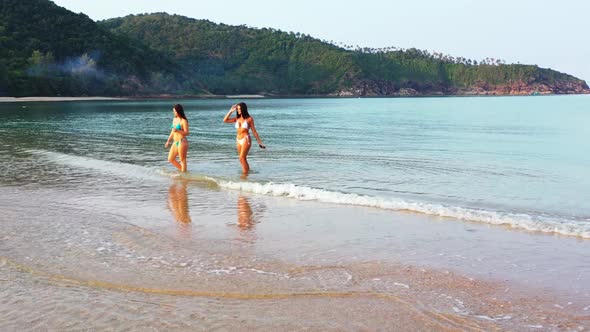 Girls look beautiful on tranquil sea view beach wildlife by clear water with white sand background o alt