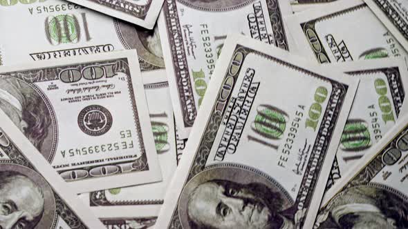 American One Hundred Dollar Paper Banknote Pile on Office Desk alt