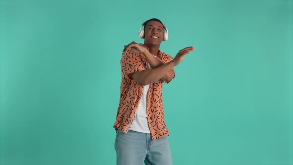 Cheerful African American Guy Dancing to Music alt