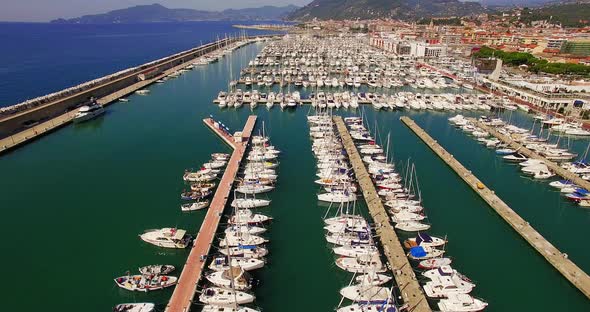 Aerial of boats moored at harbor alt