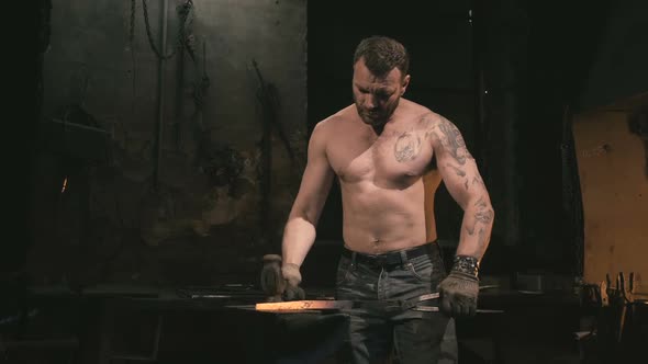 Blacksmith Working with a Serious Face alt