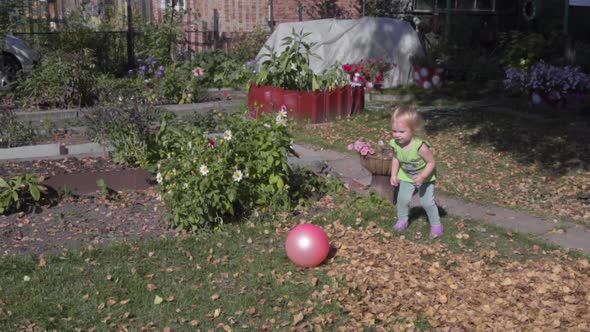 Little Girl in Autumn Garden