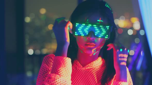 Neon  asian woman dancing. Fashion model woman in neon light, alt