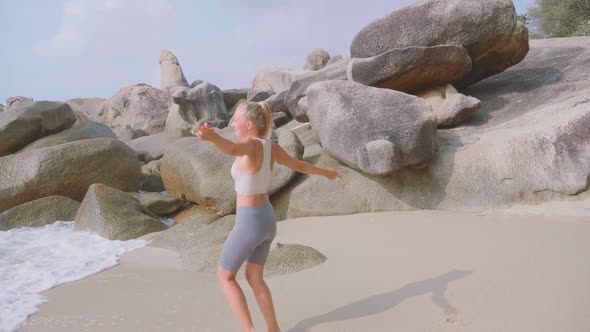 Athletic Woman Jogging Along the Beach alt