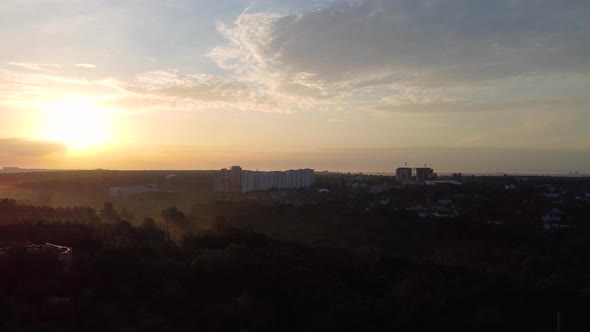 Aerial sunrise morning sky. Fly up in sun rays