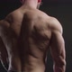 Bodybuilder in Glasses Showing Back Muscles - VideoHive Item for Sale
