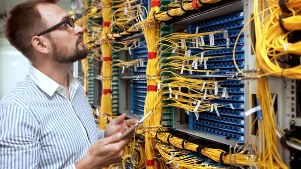 Engineer Working in Data Room alt