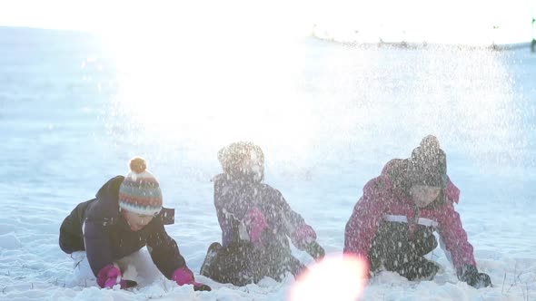 Happy Children Playing With Snow on Sunny Day, Slow Motion