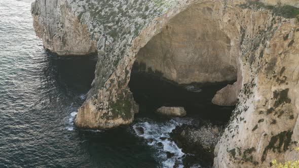 Blue Grotto Sea Caves Being Washed with Waves of Cold Mediterranean Sea Water