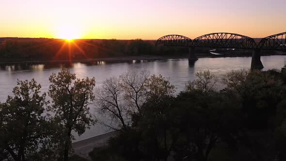 Flying towards the sun setting over North Dakota along the Missouri River alt
