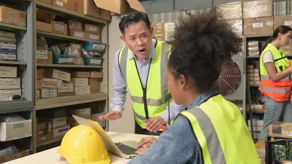 Warehouse Manager scolding female warehouse clerk that works incorrectly alt