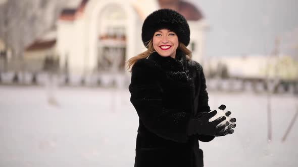 A Woman in a Winter Hat Smiles