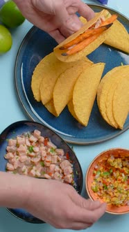 Vertical Video Recipes the Cook Makes Homemade Tacos with Salmon and Spicy Salad