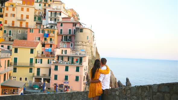 Happy Family in Honeymoon Background Old Amazing Village of Manarola, Cinque Terre, Liguria, Italy