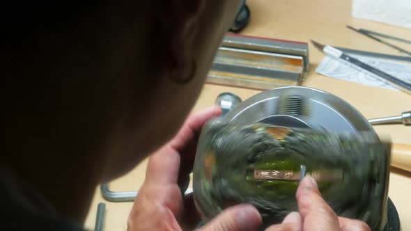 Craftswoman working in workshop alt