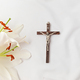 A symbolic Christian composition with christian cross lies beside a fresh white lily - PhotoDune Item for Sale