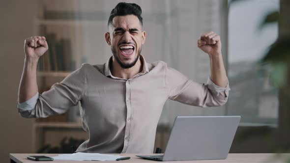 Young Successful Joyful Hispanic Man Male Investor Businessman Hold Document Look at Laptop Win alt