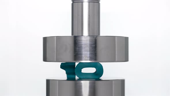 The Appearance of the Number Ten When Lifting the Rod From a Hydraulic Press on a White Background alt