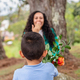 Young Boy Giving Flowers to Mother: A Heartwarming Gesture of Love and Appreciation - PhotoDune Item for Sale