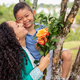Mother&#39;s Day Celebration: Loving Mom and Son Sharing a Joyful Moment with Flowers - PhotoDune Item for Sale