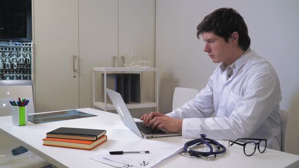 Doctor Working on Computer alt