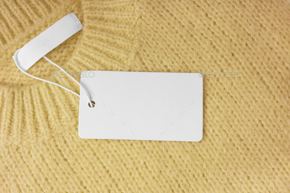 Blank Clothing Tag And Inner Label On Neck Of Yellow Knitted Sweater ...