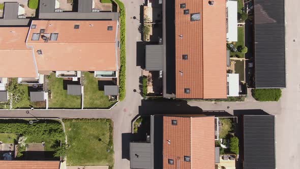 Colorful rooftops of private homes in Sweden town, aerial top down view alt