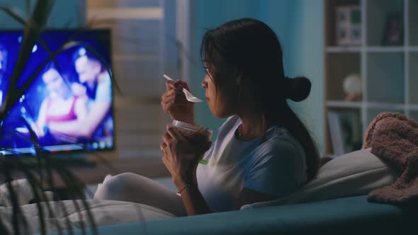Female Eating in Front of TV alt