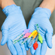 Interdental Toothbrushes in dentists hands in rubber gloves - PhotoDune Item for Sale