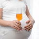 Pregnant woman with glass of wine. Irresponsible woman concept - PhotoDune Item for Sale